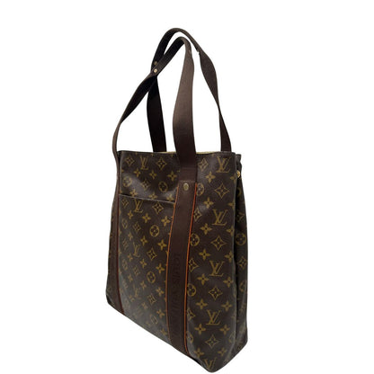 lato  Borsa Louis Vuitton realizzata in tela monogram marrone con finiture in vacchetta naturale e rifinita con parti in tessuto, di lusso, originale, ottime condizioni, usata. 
