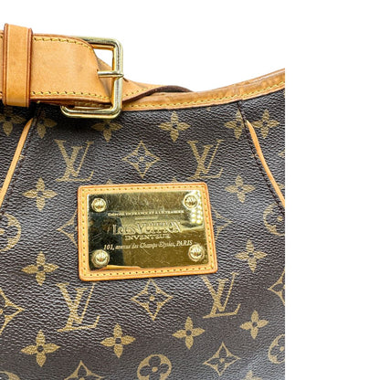 Borsa Louis Vuitton realizzata in tela monogram marrone con finiture in vacchetta naturale.