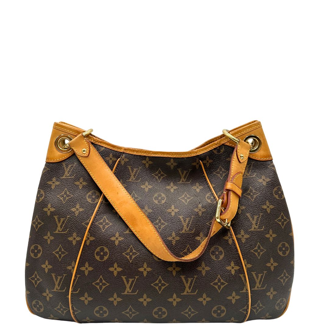 Retro, Borsa Louis Vuitton realizzata in tela monogram marrone con finiture in vacchetta naturale.