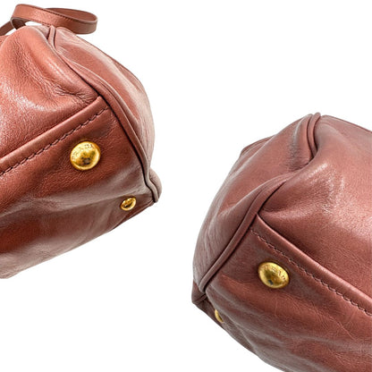 angoli Satchel Prada color rosa antico e hardware dorato, puoi portarla comodamente a tracolla o mano, di lusso, originale, usata, ottime condizioni. 