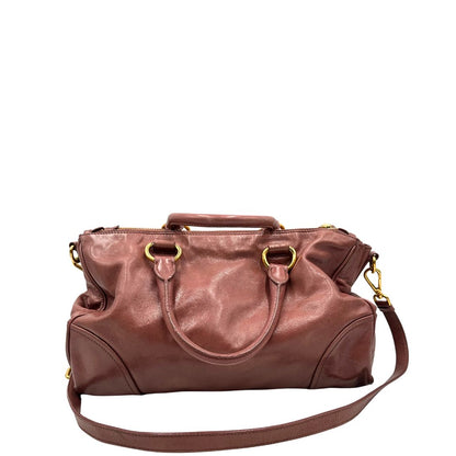 retro Satchel Prada color rosa antico e hardware dorato, puoi portarla comodamente a tracolla o mano, di lusso, originale, usata, ottime condizioni. 