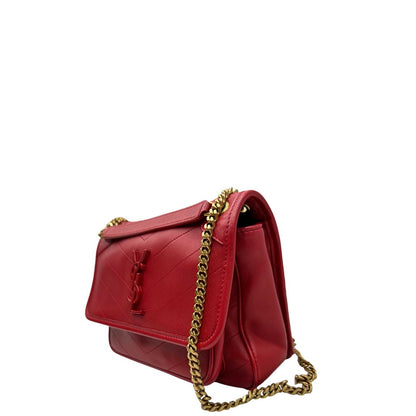 lato  Borsa Niki Saint Laurent rossa nella versione baby, di lusso, originale, ottime condizioni, usata. 