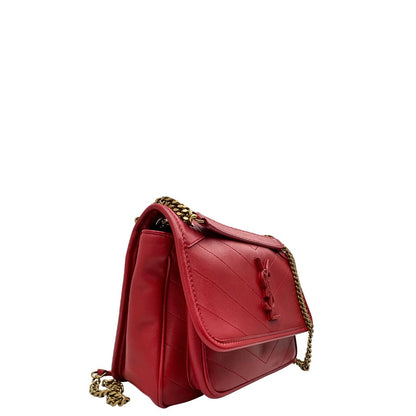 lato  Borsa Niki Saint Laurent rossa nella versione baby, di lusso, originale, ottime condizioni, usata. 