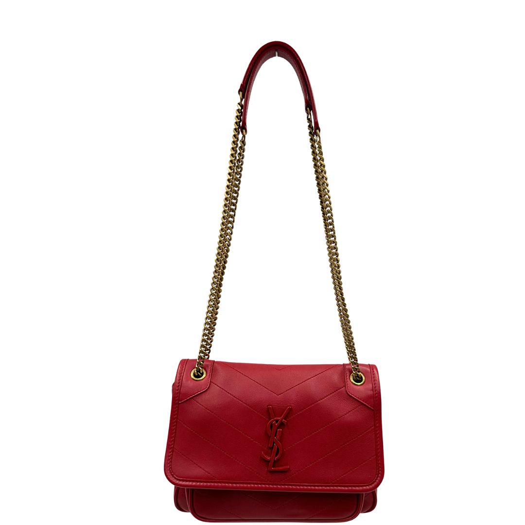front  Borsa Niki Saint Laurent rossa nella versione baby, di lusso, originale, ottime condizioni, usata. 