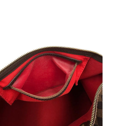 Interno della tasca, Louis Vuitton Speedy in tela Damier Ébène marrone e hardware dorato. Originale, usato, di lusso, in buone condizioni.