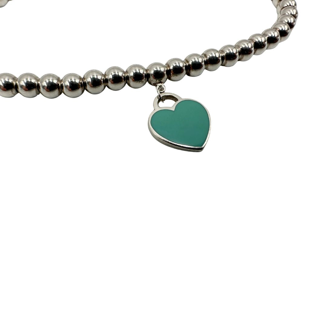 Bracciale Tiffany&Co. in argento 925 con ciondolo in argento con finitura smaltata Tiffany Blue, di lusso, originale, ottime condizioni, usato.