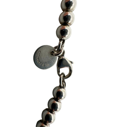 Bracciale Tiffany&Co. in argento 925 con ciondolo in argento con finitura smaltata Tiffany Blue, di lusso, originale, ottime condizioni, usato.