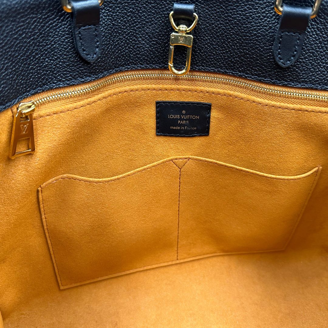 interno  Louis Vuitton OnTheGo nella versione MM in morbida pelle monogram Empreinte, di lusso, originale, ottime condizioni, usata. 