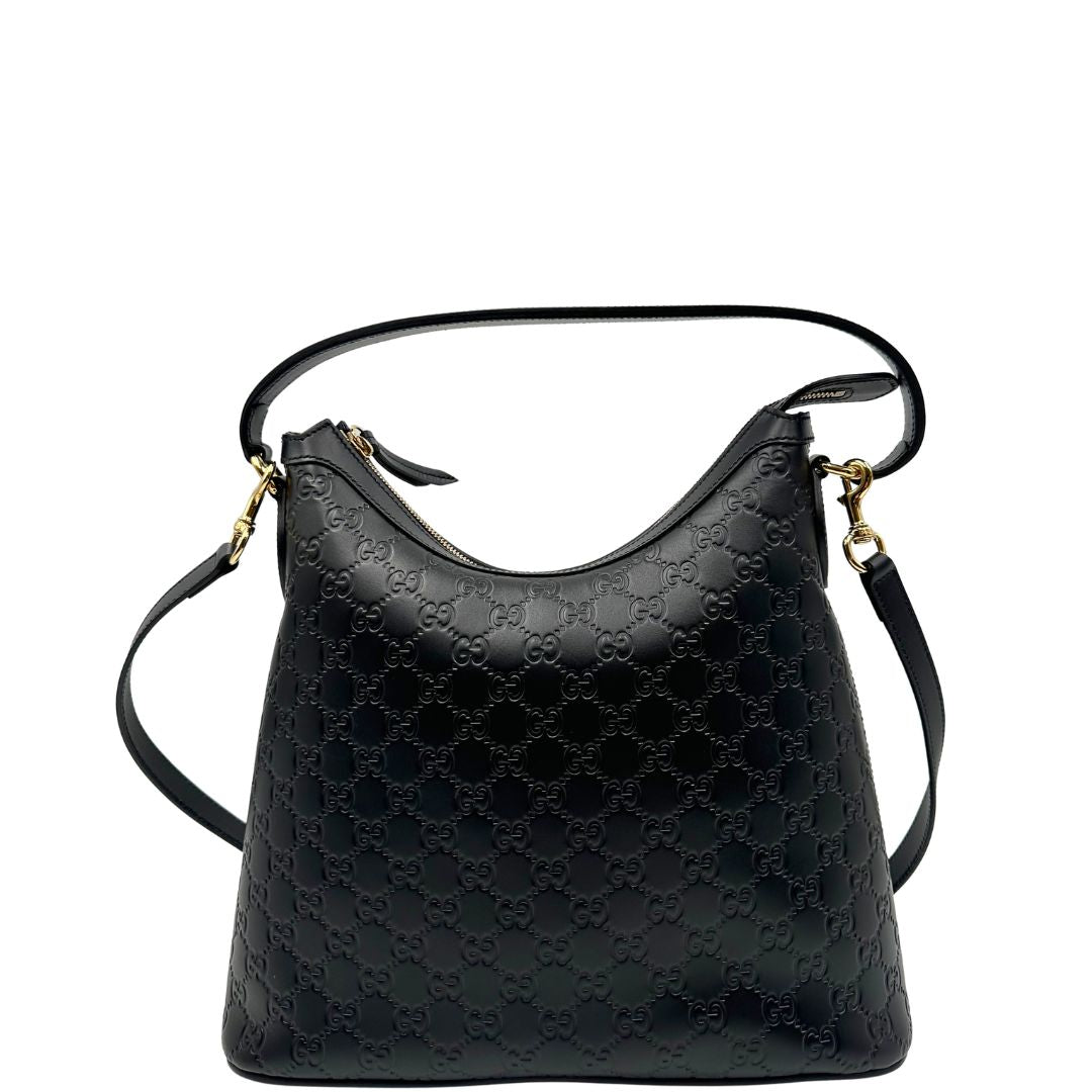 Front, Borsa Gucci in pelle nera GG con hardware dorato. Originale, usata, di lusso, in condizioni eccellenti.