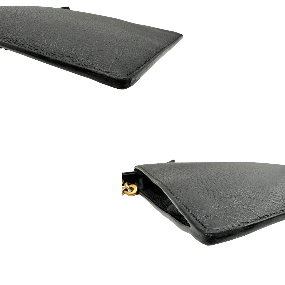 Angoli, Pochette Gucci in pelle martellata nera e hardware dorato. Originale, usata, di lusso, in ottime condizioni.