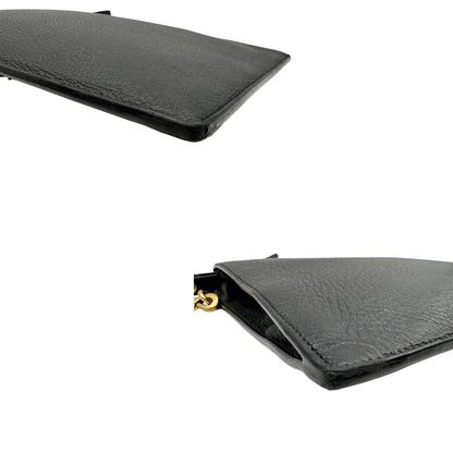 Angoli, Pochette Gucci in pelle martellata nera e hardware dorato. Originale, usata, di lusso, in ottime condizioni.