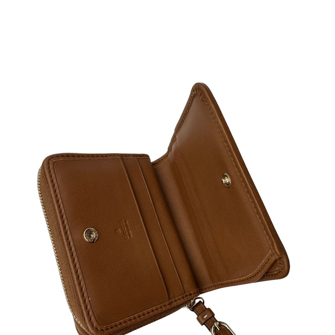 Portafoglio Gucci con trama GG Supreme, di lusso, originale, ottime condizioni, usato.