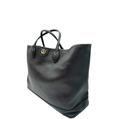 lato Shopper Gucci in pelle nera impreziosita da doppia GG in metallo dorato, di lusso, originale, ottime condizioni, usata. 