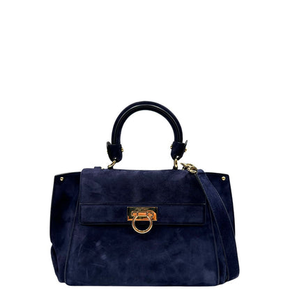 Front, Borsa Salvatore Ferragamo realizzata in& pelle scamosciata di colore blu navy, con manico superiore e dettagli in metallo dorato.
