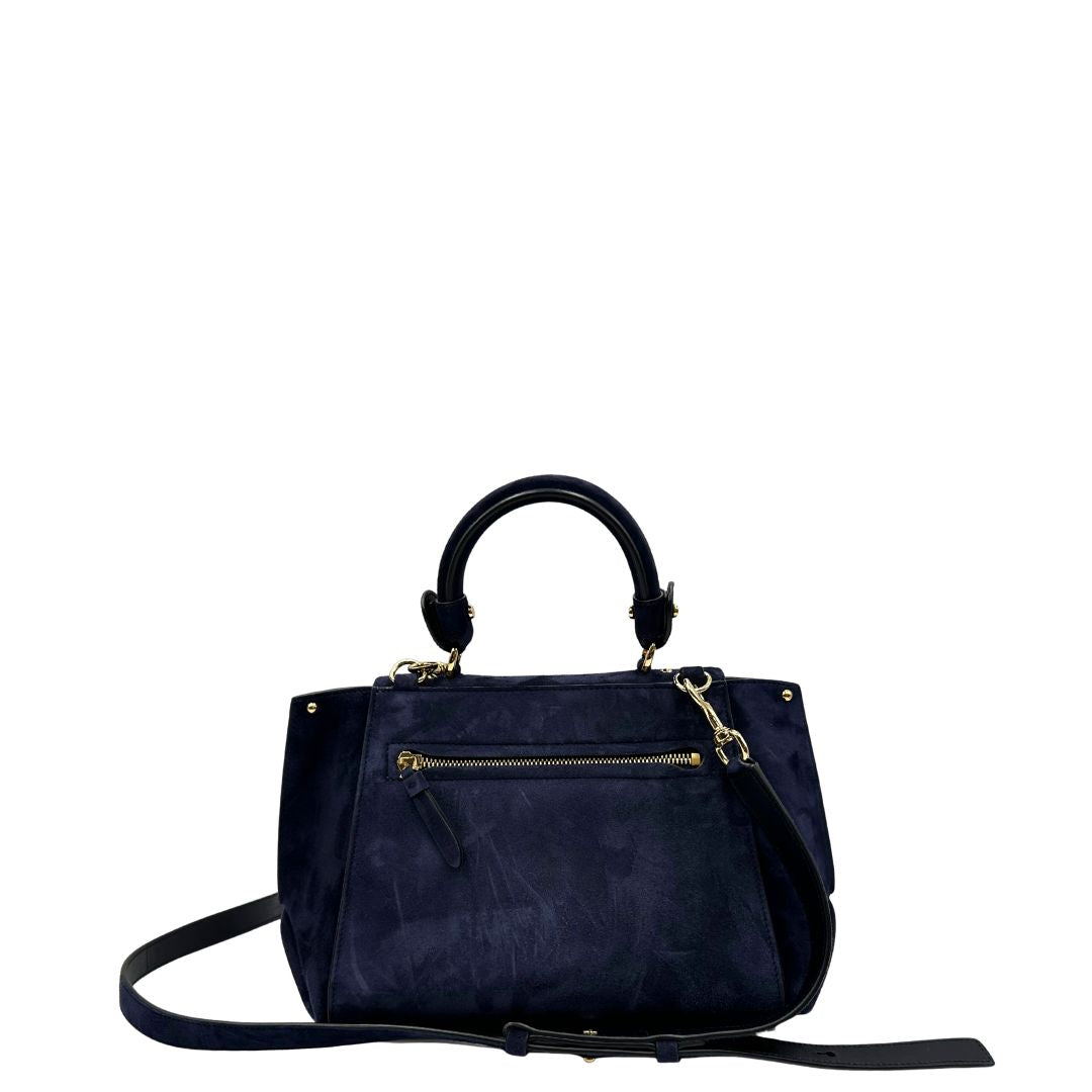 Retro, Borsa Salvatore Ferragamo realizzata in& pelle scamosciata di colore blu navy, con manico superiore e dettagli in metallo dorato.