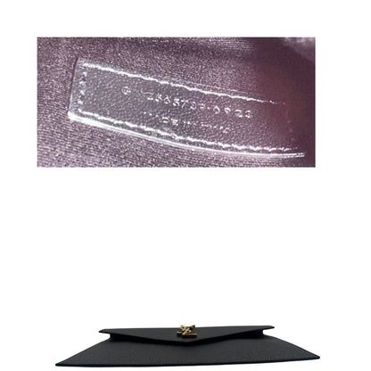 base Pochette Saint Laurent in pelle nera martellata impreziosita dall'iconico logo Cassandre, di lusso, originale, eccellenti condizioni, usata.