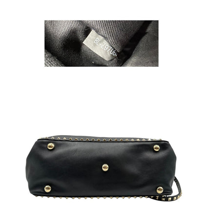 base Rockstud Valentino Garavani rifinita con borchie piramidali oro chiaro, di lusso, originale, ottime condizioni, usata.