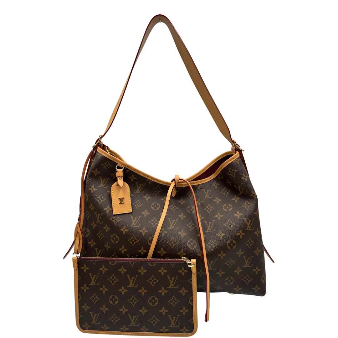 front  La borsa CarryAll MM è realizzata in tela Monogram e rifinita in pelle naturale, di lusso, originale, ottime condizioni, usata. 