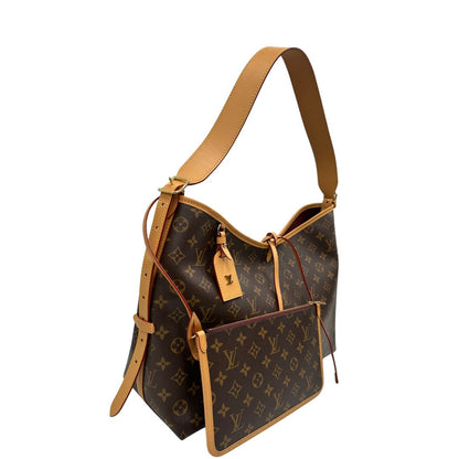 lato  La borsa CarryAll MM è realizzata in tela Monogram e rifinita in pelle naturale, di lusso, originale, ottime condizioni, usata. 