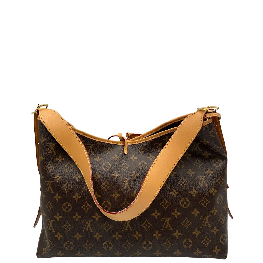 retro  La borsa CarryAll MM è realizzata in tela Monogram e rifinita in pelle naturale, di lusso, originale, ottime condizioni, usata. 