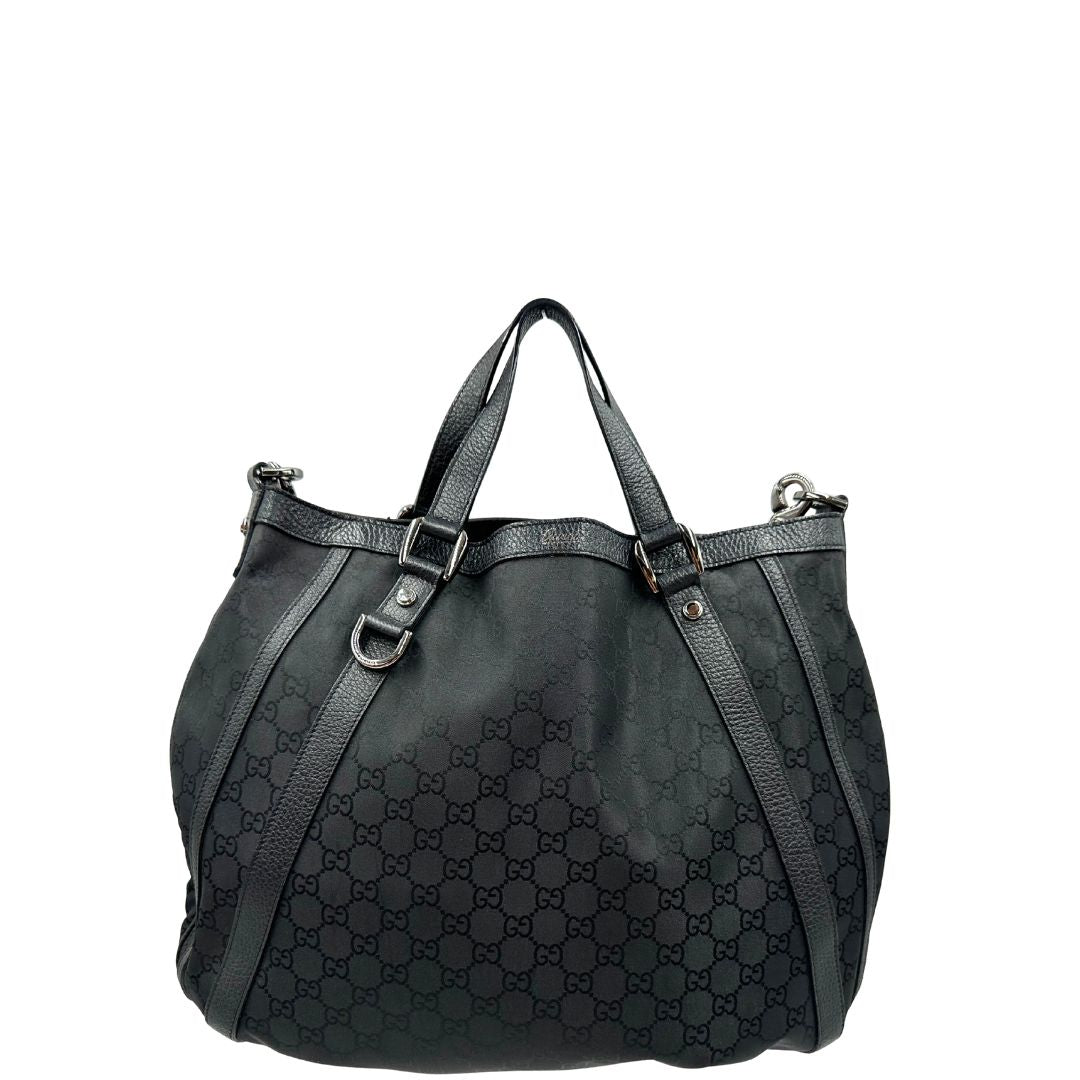  Front, Borsa Gucci in tessuto nero trama GG, con parti metalliche argentate, indossabile a mano o a spalla. Originale, usata, di lusso, in ottime condizioni.