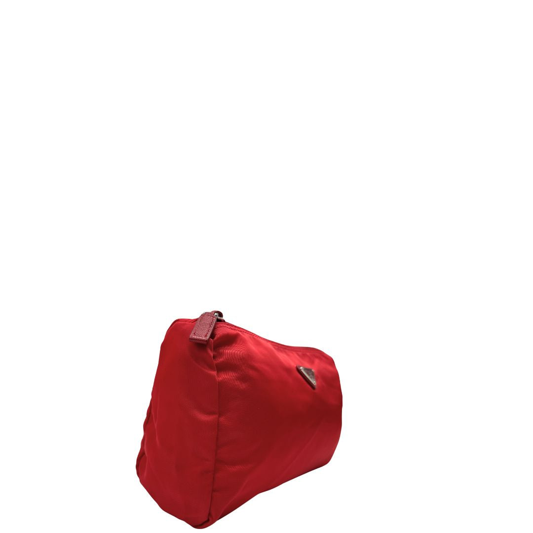 Lato destro, Necessaire Prada in tessuto Vela rosso e hardware argentato. Originale, usata, di lusso, in ottime condizioni.