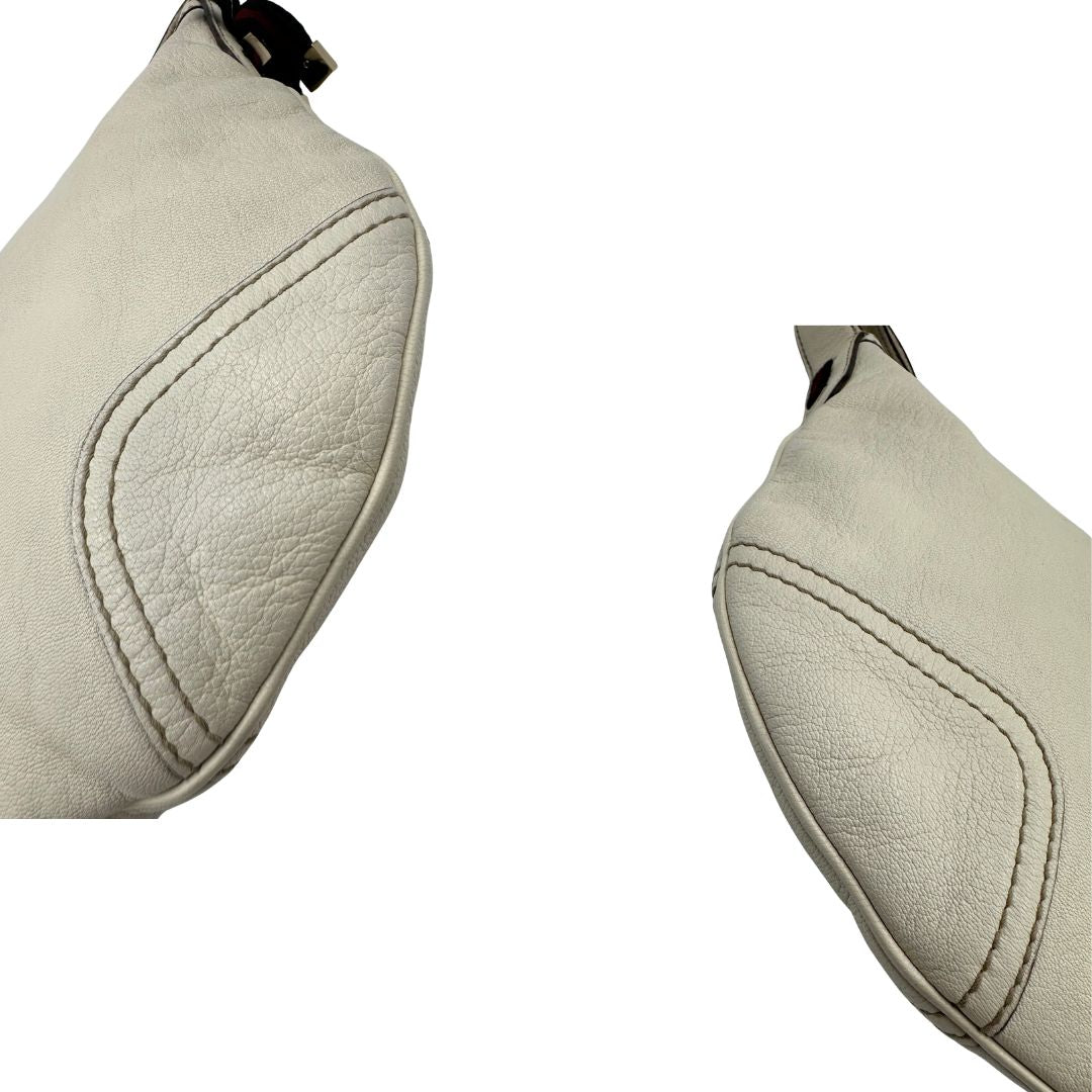 angoli Mini Hobo Gucci in pelle impreziosita da fiocco Web blu e rosso, di lusso, originale, ottime condizioni, usata. 