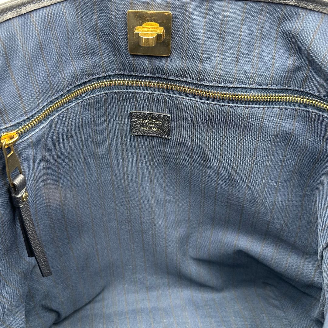 Borsa Louis Vuitton in pelle blu monogram empreinte, di lusso, originale, ottime condizioni, usata.