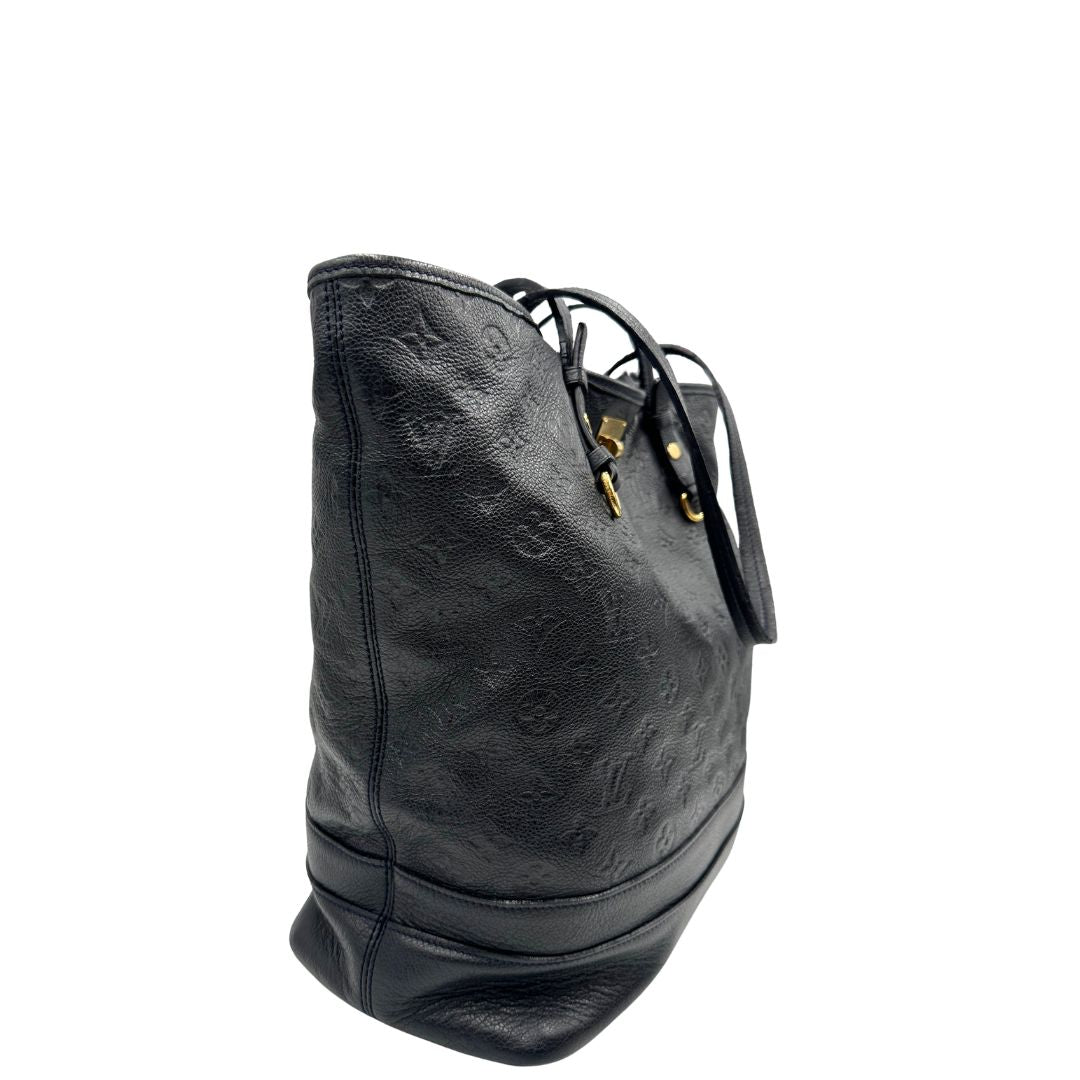 lato Borsa Louis Vuitton in pelle blu monogram empreinte, di lusso, originale, ottime condizioni, usata. 