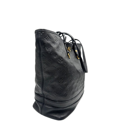 lato Borsa Louis Vuitton in pelle blu monogram empreinte, di lusso, originale, ottime condizioni, usata. 