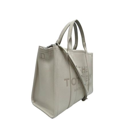 lato Borsa The Tote Bag Marc Jacobs in pelle bianca nella versione media, di lusso, originale, ottime condizioni, usata. 