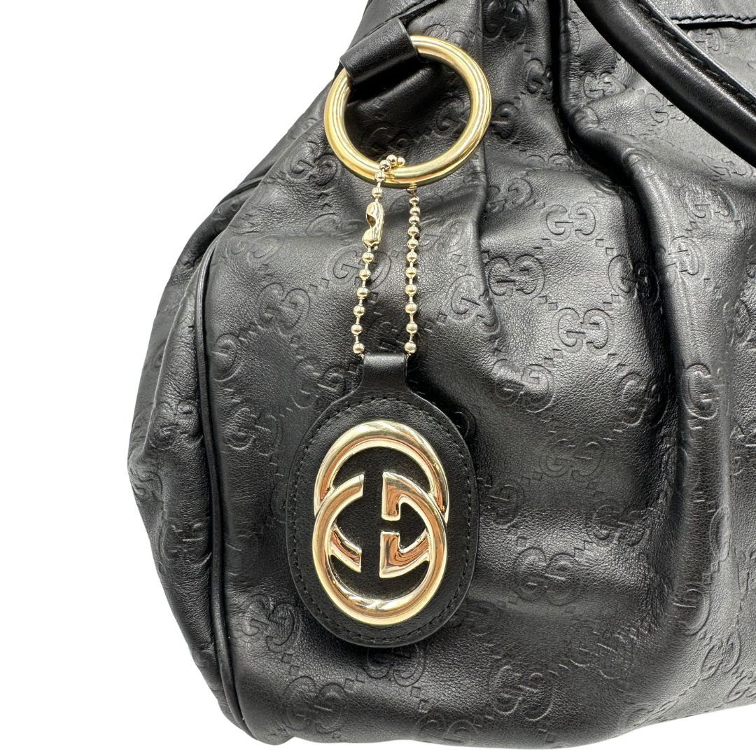 Borsa Gucci in pelle nera GG, munita di doppi manici, di lusso, originale, ottime condizioni, usata.