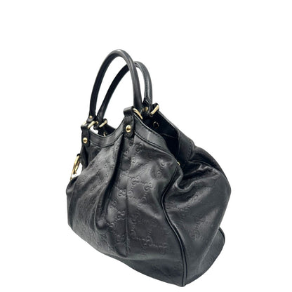 lato Borsa Gucci in pelle nera GG, munita di doppi manici, di lusso, originale, ottime condizioni, usata. 