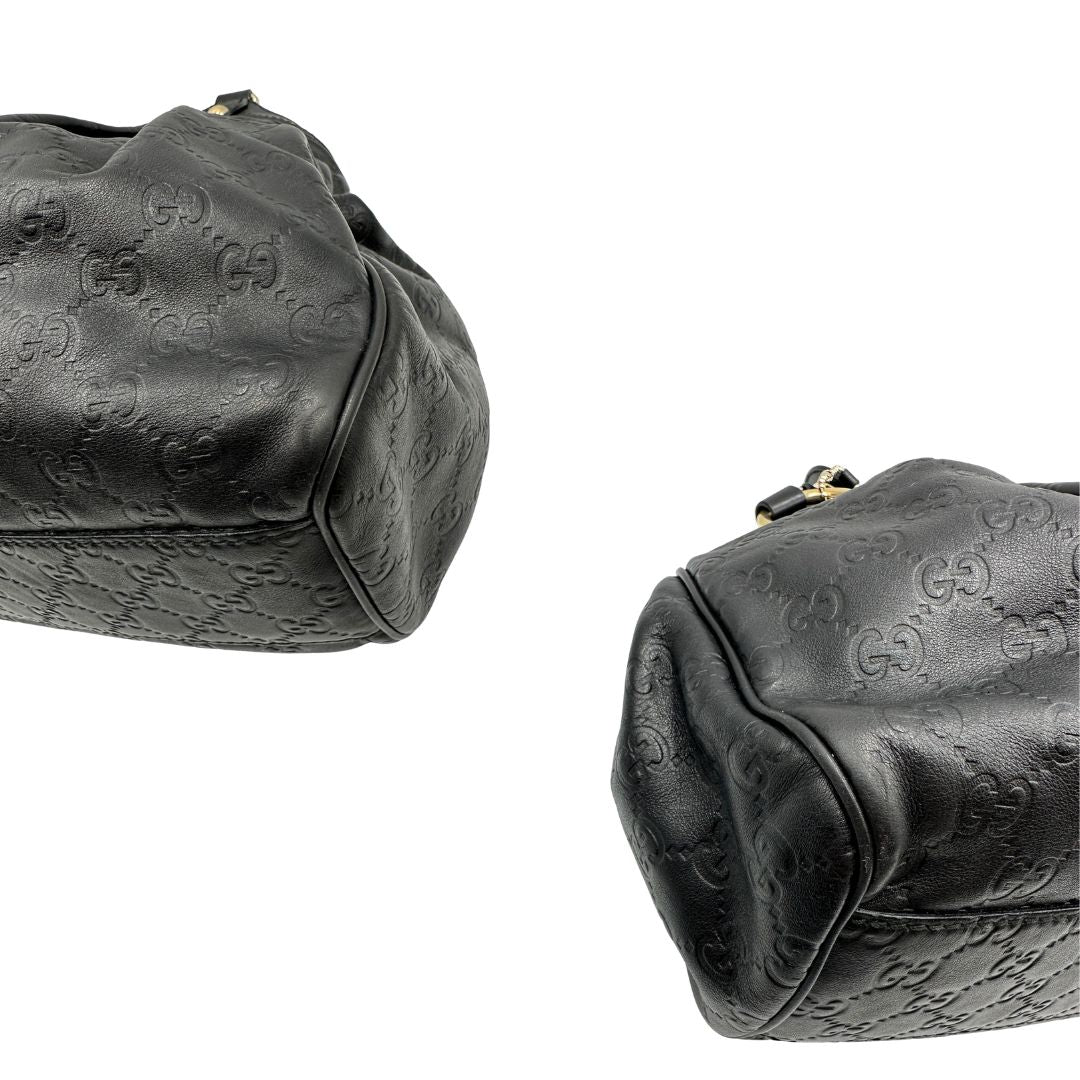 angoli Borsa Gucci in pelle nera GG, munita di doppi manici, di lusso, originale, ottime condizioni, usata. 