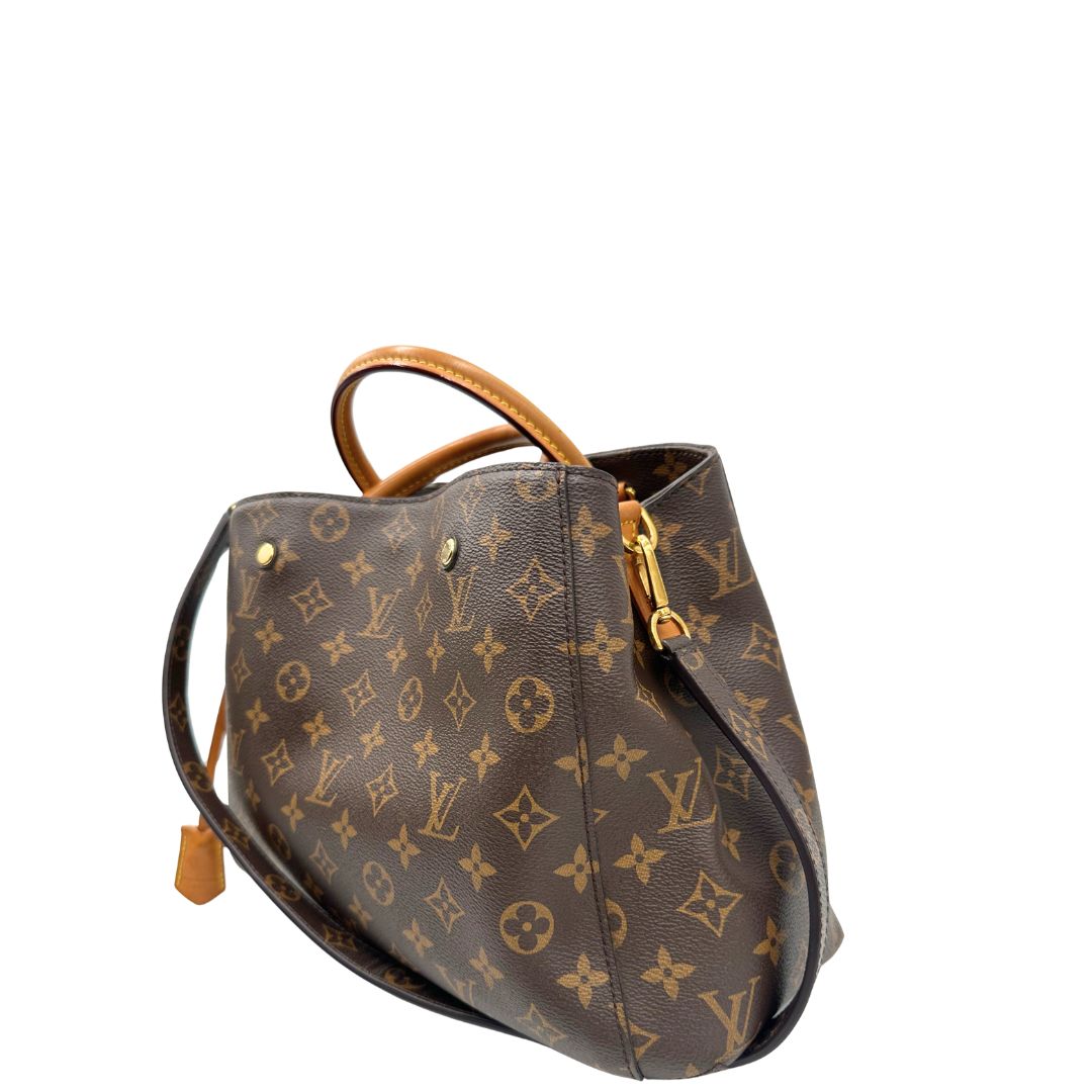 lato  Borsa LV Montaigne nella versione MM in canvas monogram, di lusso, originale, ottime condizioni, usata. 