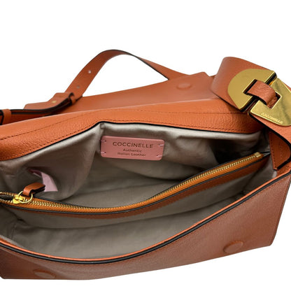 Borsa Coccinelle in pelle martellata color terracotta, di lusso, originale, ottime condizioni, usata.