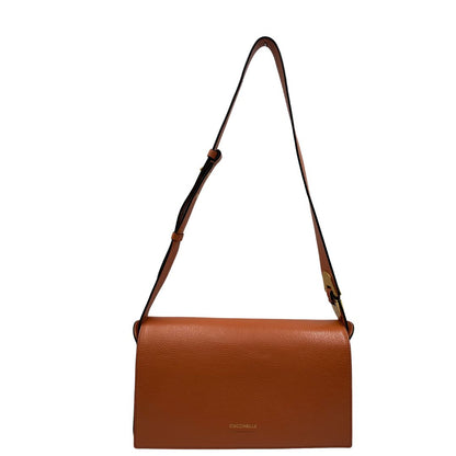 Borsa Coccinelle in pelle martellata color terracotta, di lusso, originale, ottime condizioni, usata.