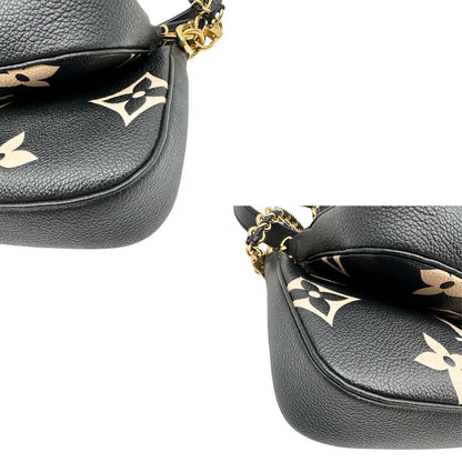 angoli  Borsa LV in pelle monogram empreinte nera e beige, di lusso, eccellenti condizioni, usata. 