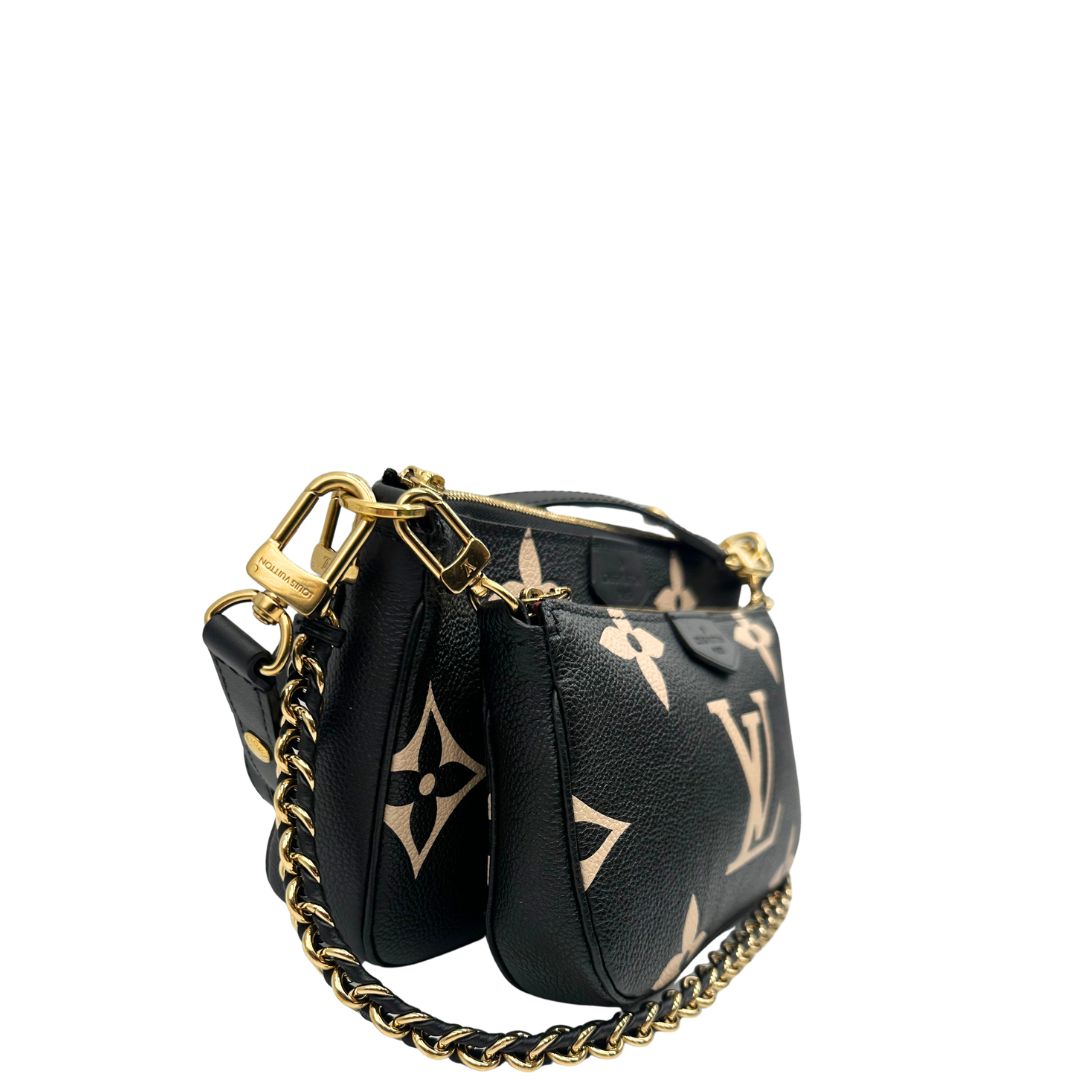 lato  Borsa LV in pelle monogram empreinte nera e beige, di lusso, eccellenti condizioni, usata. 