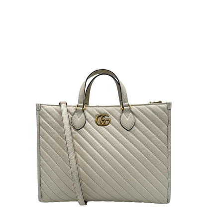 front Borsa Gucci in pelle bianca con logo GG in metallo dorato sul front, di lusso, originale, ottime condizioni, usata. 