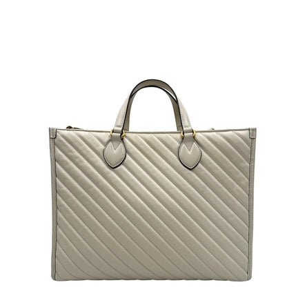 retro Borsa Gucci in pelle bianca con logo GG in metallo dorato sul front, di lusso, originale, ottime condizioni, usata. 