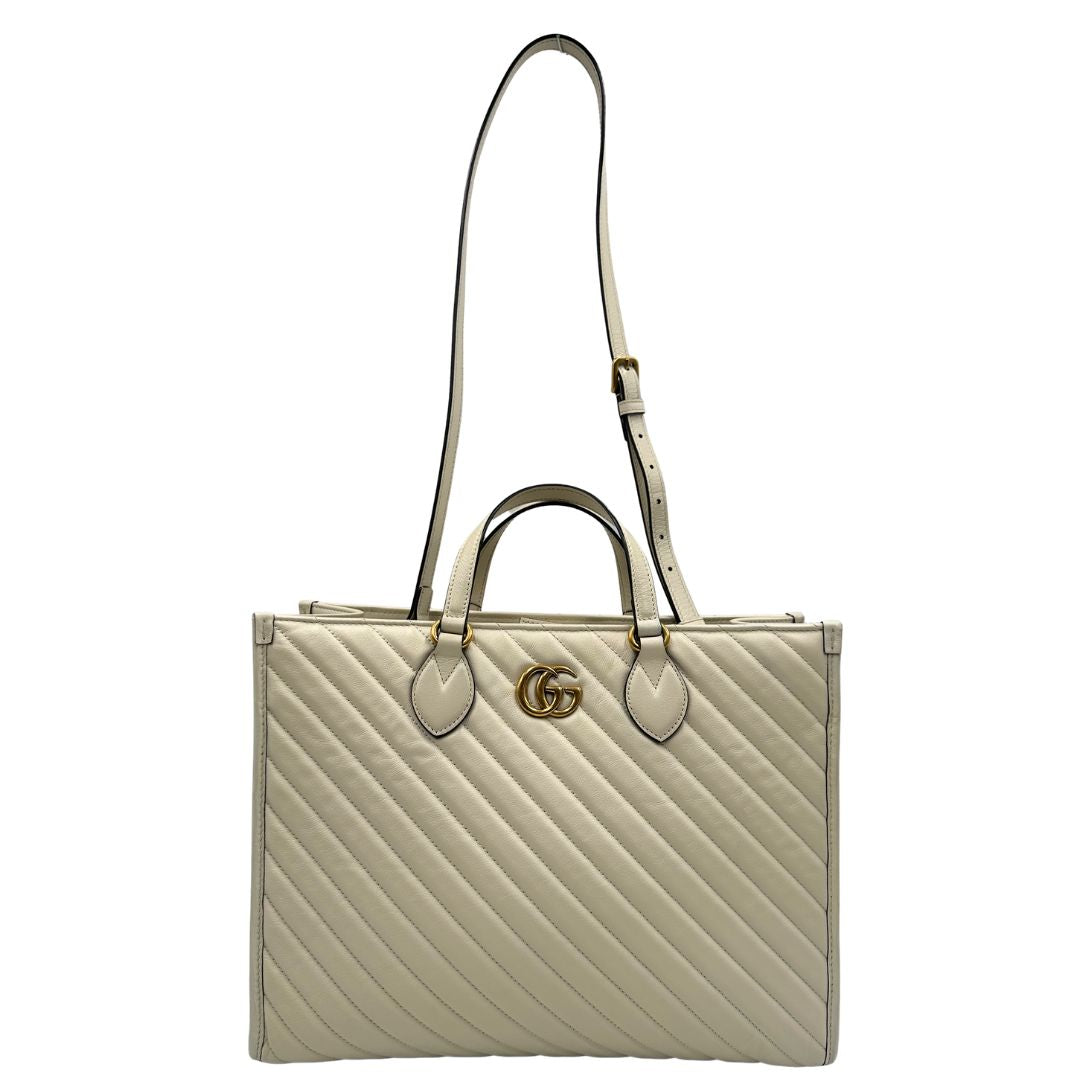 front Borsa Gucci in pelle bianca con logo GG in metallo dorato sul front, di lusso, originale, ottime condizioni, usata. 