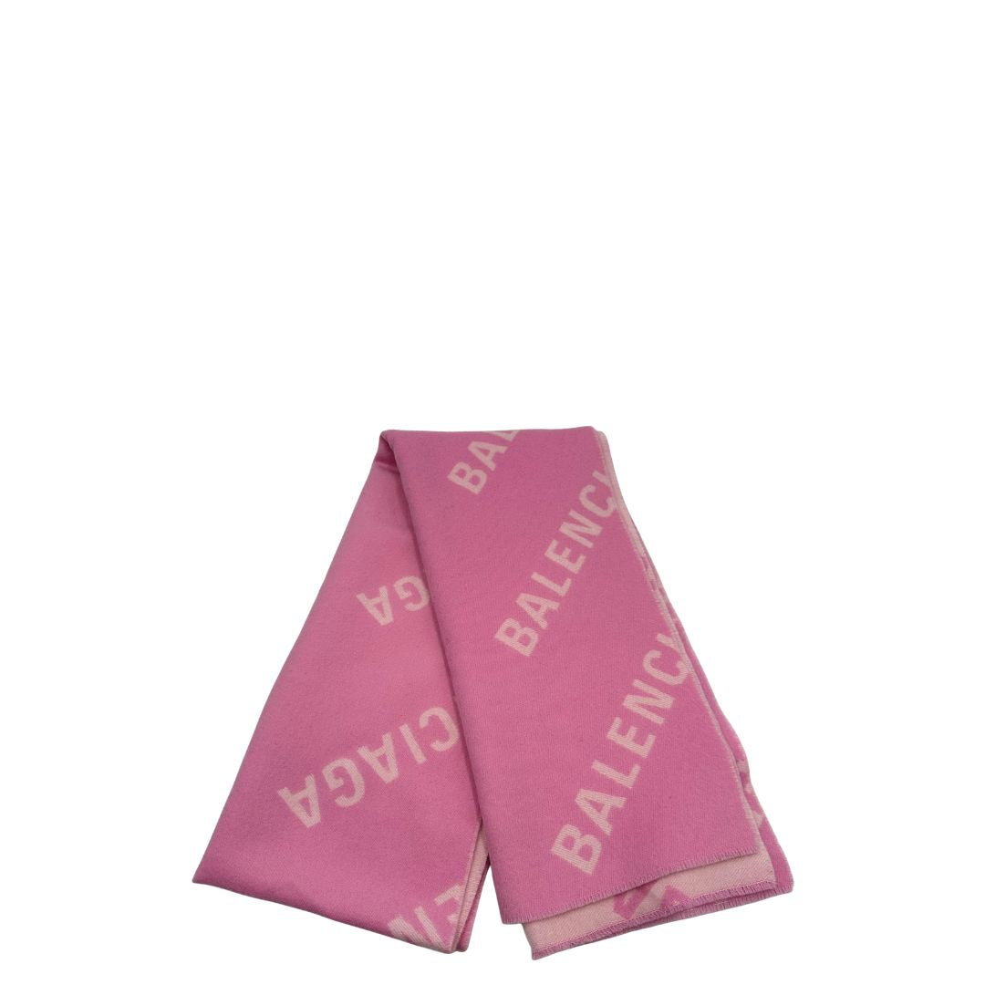 Sciarpa Balenciaga in 100% lana rosa con il monogramma del brand ripetuto su entrambi i lati. Originale, usata, di lusso, in ottime condizioni.