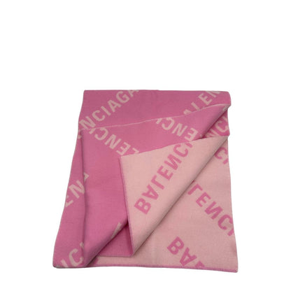 Sciarpa Balenciaga in 100% lana rosa con il monogramma del brand ripetuto su entrambi i lati. Originale, usata, di lusso, in ottime condizioni.