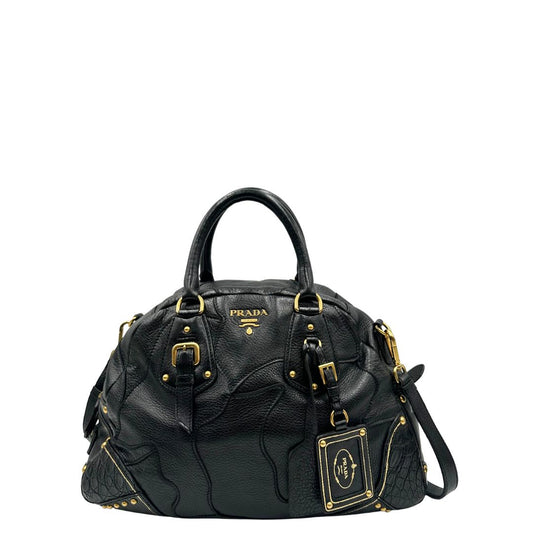 front Borsa Satchel Prada in pelle nera e hardware dorato, munita di doppi manici e una tracolla amovibile e regolabile, di lusso, originale, ottime condizioni, usata.