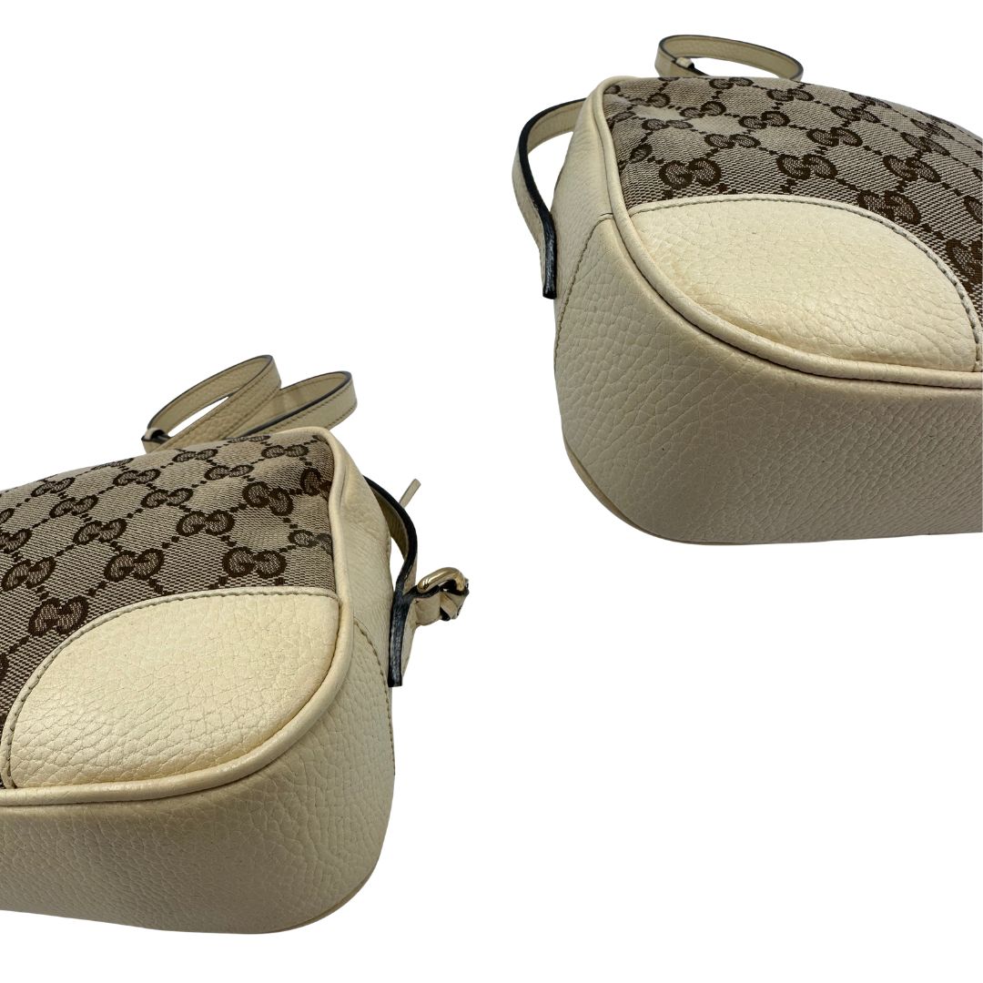angoli  Camera Bag Gucci in tessuto GG con finiture in pelle color avorio, di lusso, originale, ottime condizioni, usata. 
