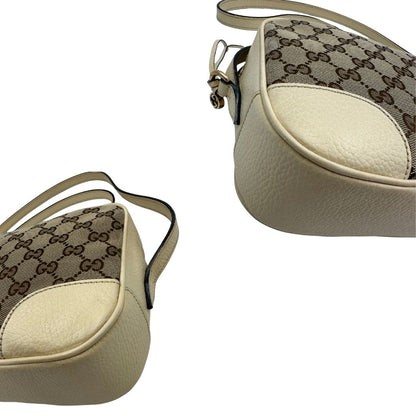 angoli  Camera Bag Gucci in tessuto GG con finiture in pelle color avorio, di lusso, originale, ottime condizioni, usata. 