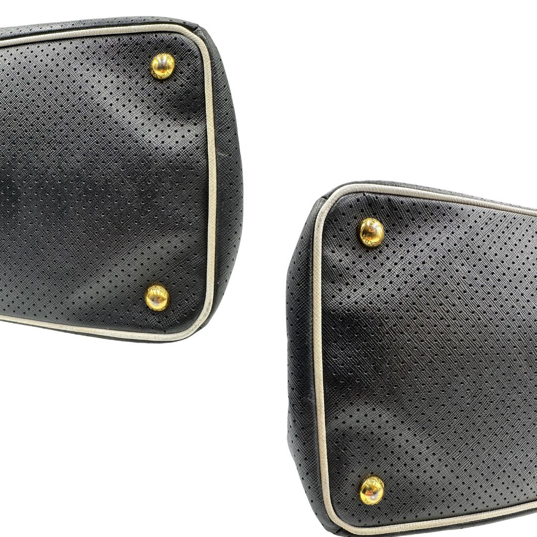 angoli Borsa Prada Galleria in pelle traforata nera con eleganti profili bianchi, di lusso, originale, ottime condizioni, usata. 