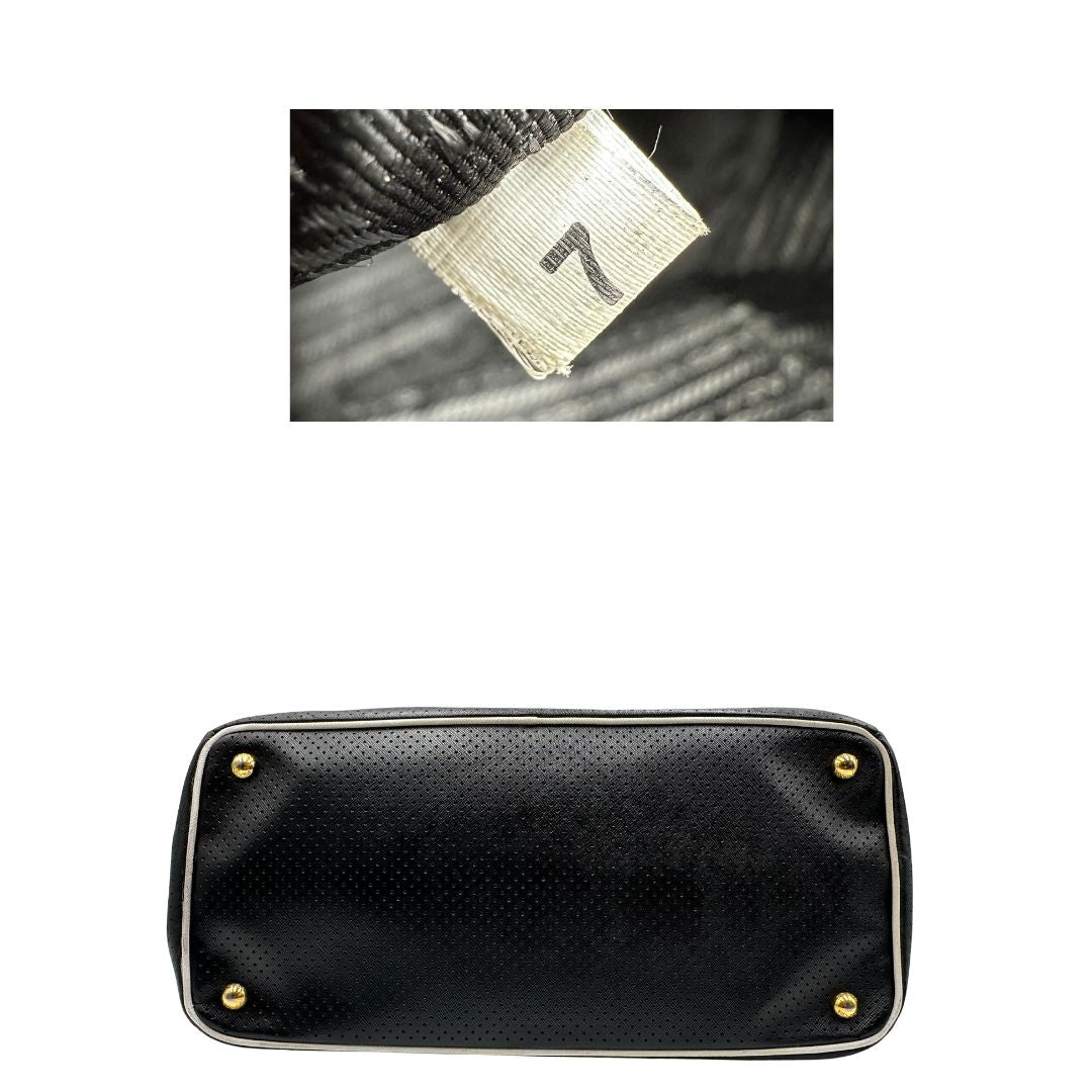 base Borsa Prada Galleria in pelle traforata nera con eleganti profili bianchi, di lusso, originale, ottime condizioni, usata. 