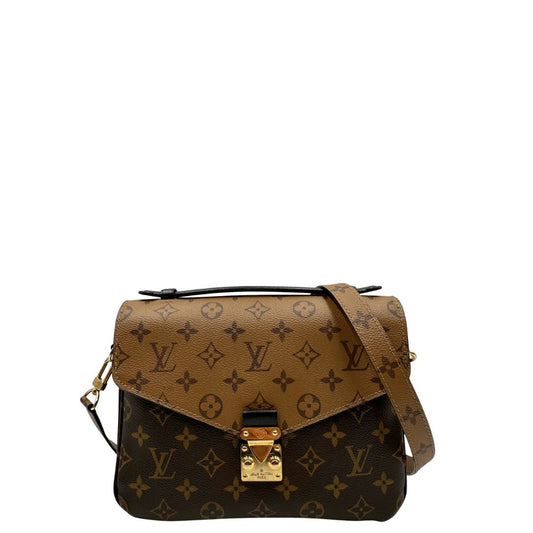 Front, Borsa LV Métis in canvas marrone monogram reverse con parti metalliche dorate; Indossabile a mano oppure a tracolla. Originale, usata, di lusso, in ottime condizioni.